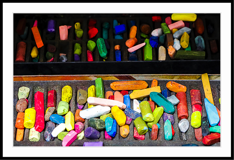 Broken colored chalk in various shapes and colors.